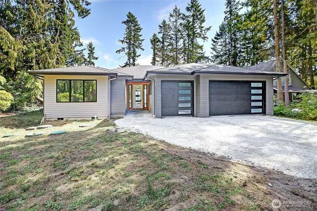 a roof deck with table and chairs