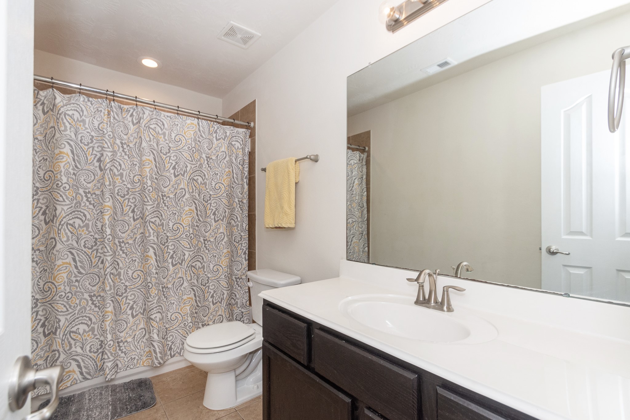 4907 Applewood Crest Lane Rosharon, TX 77583 - Photo 27 of 36 a bathroom with a granite countertop sink toilet and a mirror