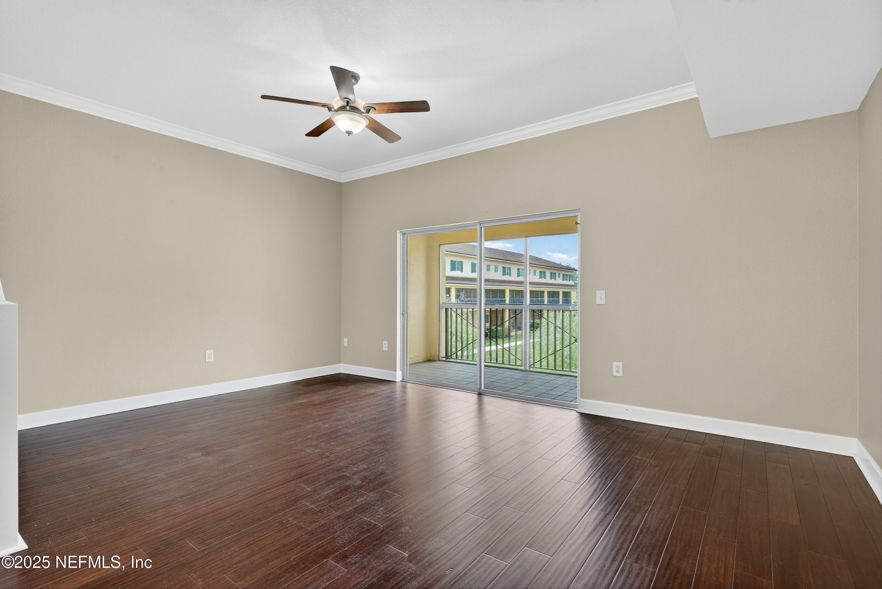 9745 Touchton Road, Unit 1625 Jacksonville, FL 32246 - Photo 11 of 69 wooden floor in an empty room with a window