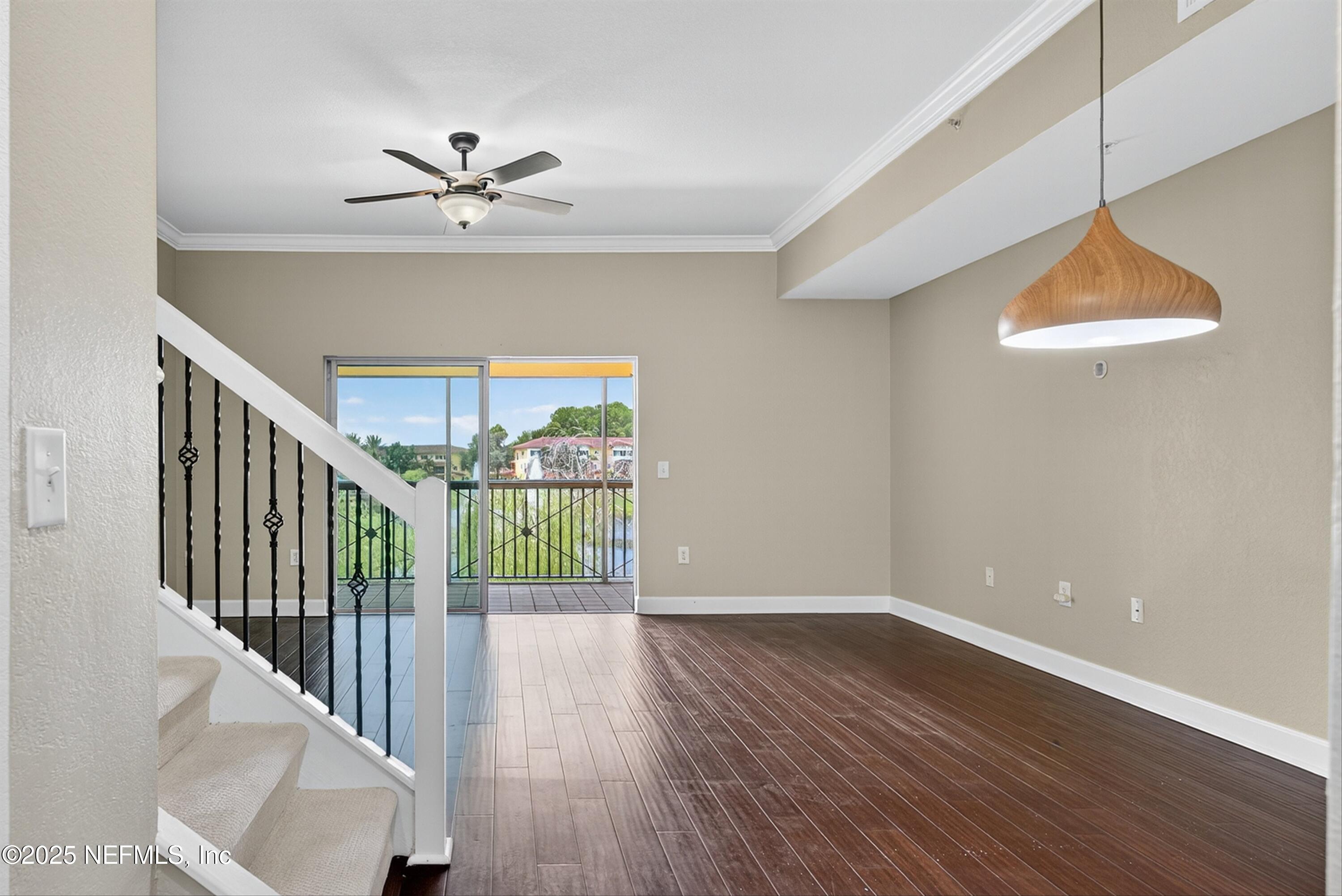 9745 Touchton Road, Unit 1625 Jacksonville, FL 32246 - Photo 14 of 69 wooden floor in an empty room with a window