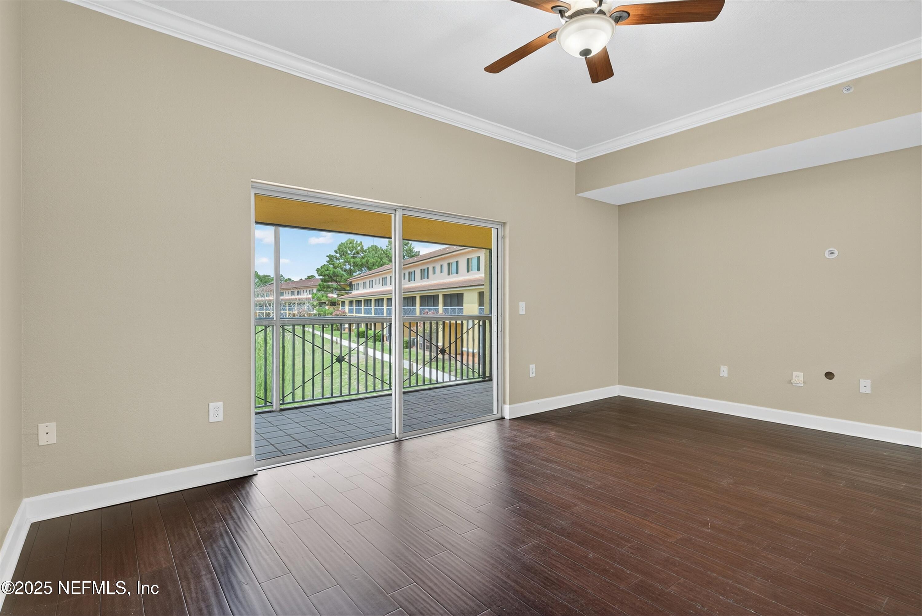 9745 Touchton Road, Unit 1625 Jacksonville, FL 32246 - Photo 18 of 69 wooden floor in an empty room with a window