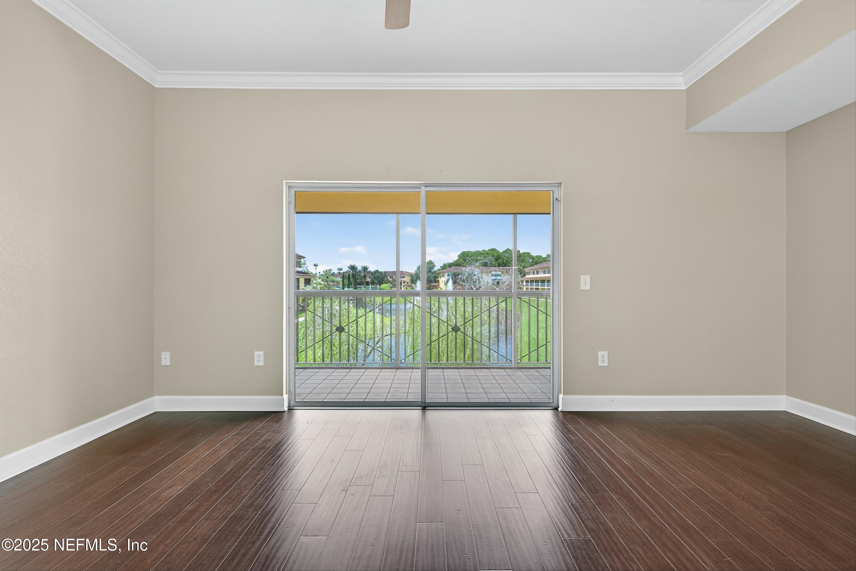 9745 Touchton Road, Unit 1625 Jacksonville, FL 32246 - Photo 19 of 69 a view of an empty room with wooden floor and a window