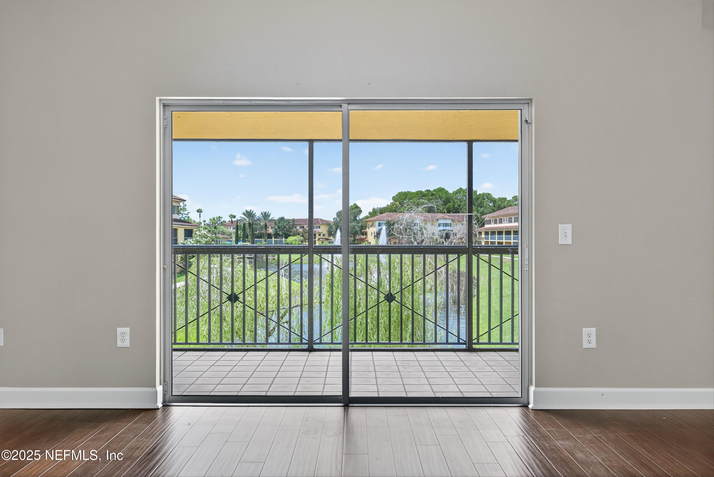 9745 Touchton Road, Unit 1625 Jacksonville, FL 32246 - Photo 20 of 69 a view of a room with wooden floor and a window