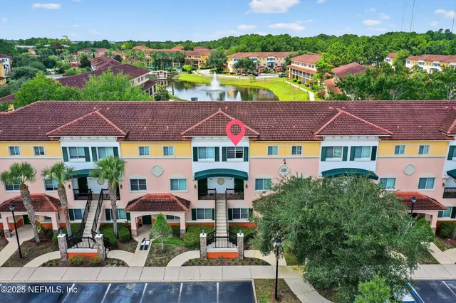 a view of an buildings with swimming pool and sitting area