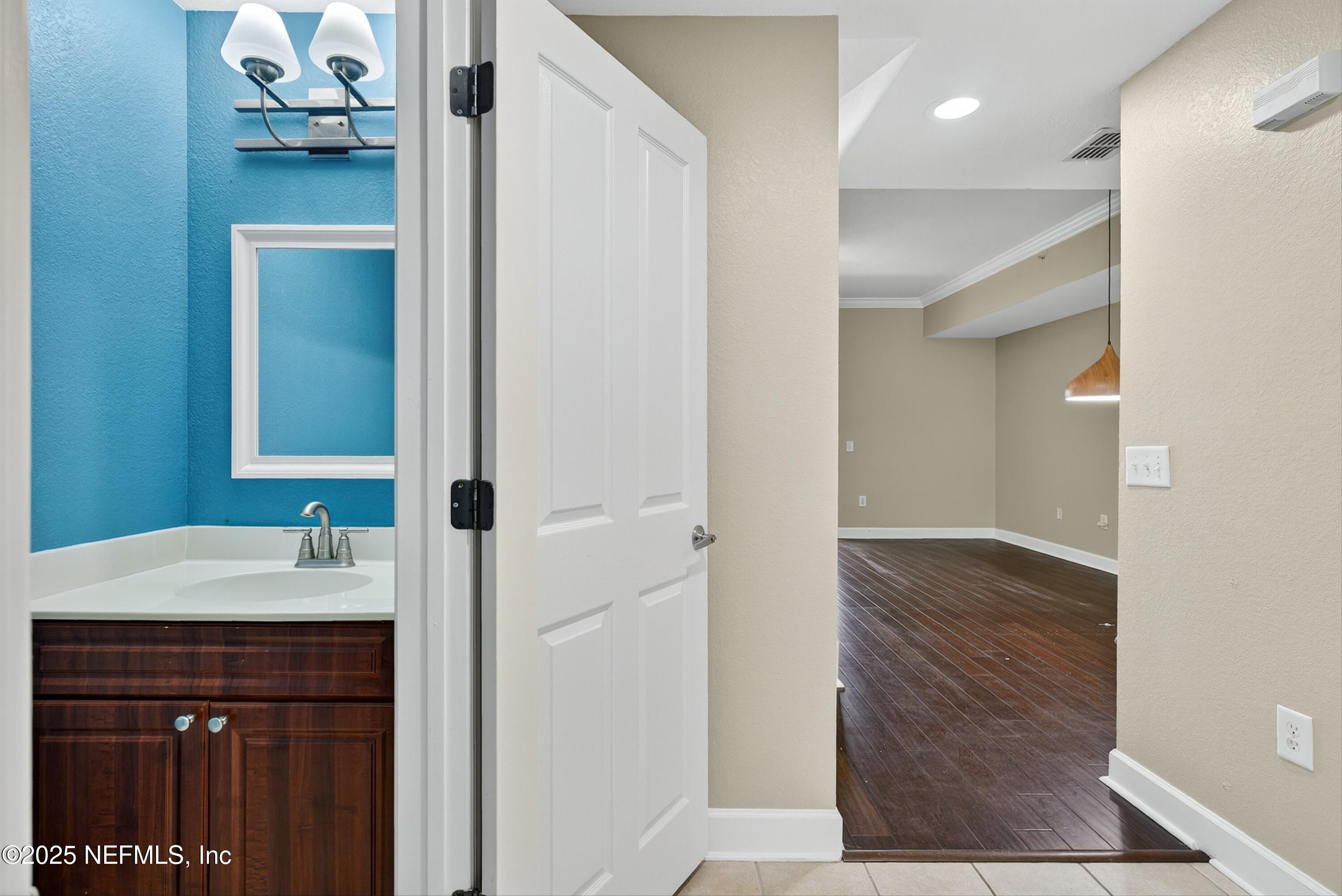 9745 Touchton Road, Unit 1625 Jacksonville, FL 32246 - Photo 26 of 69 a bathroom with a sink and a mirror