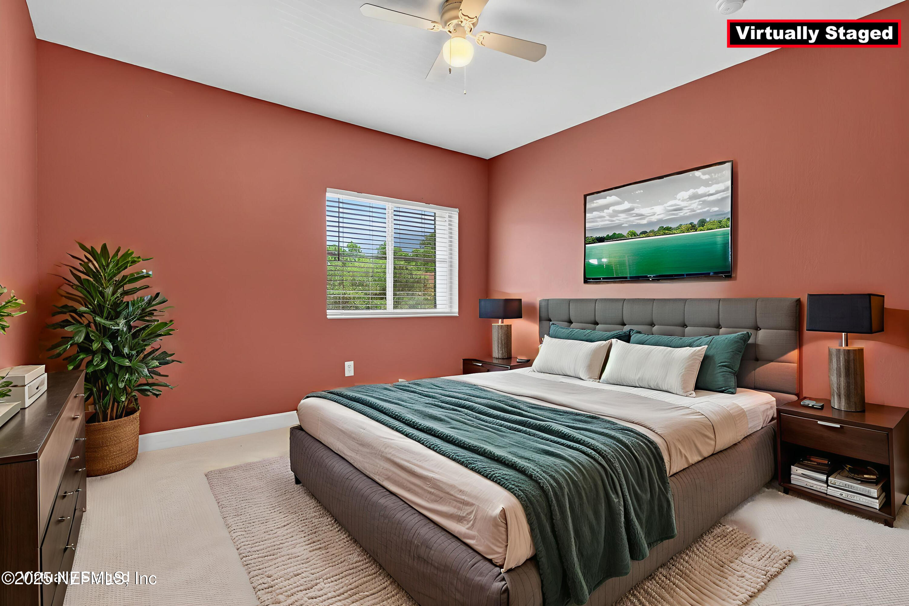 9745 Touchton Road, Unit 1625 Jacksonville, FL 32246 - Photo 35 of 69 a bedroom with bed and a potted plant