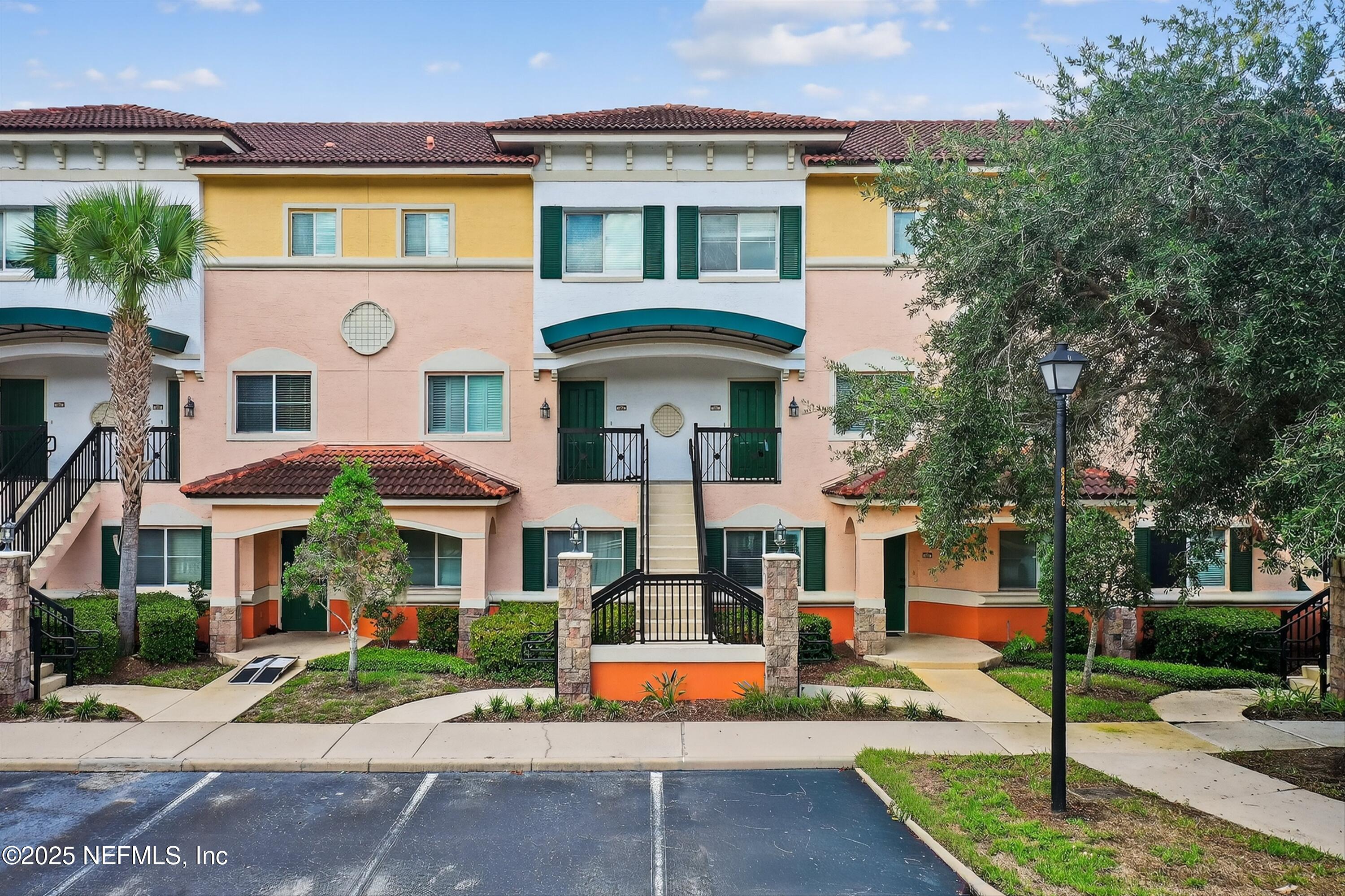 9745 Touchton Road, Unit 1625 Jacksonville, FL 32246 - Photo 4 of 69 a front view of a residential apartment building with a yard