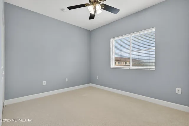 a view of a house with garden and patio