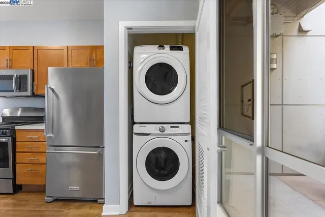 a view of a refrigerator with washer and dryer