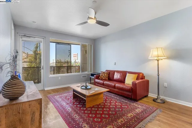 a living room with furniture a lamp and a table