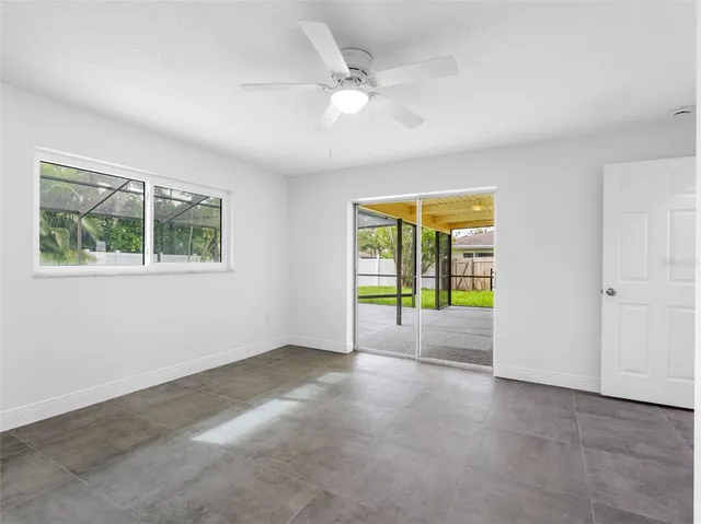 a view of a backyard with swimming pool