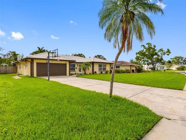 an aerial view of a house with a garden