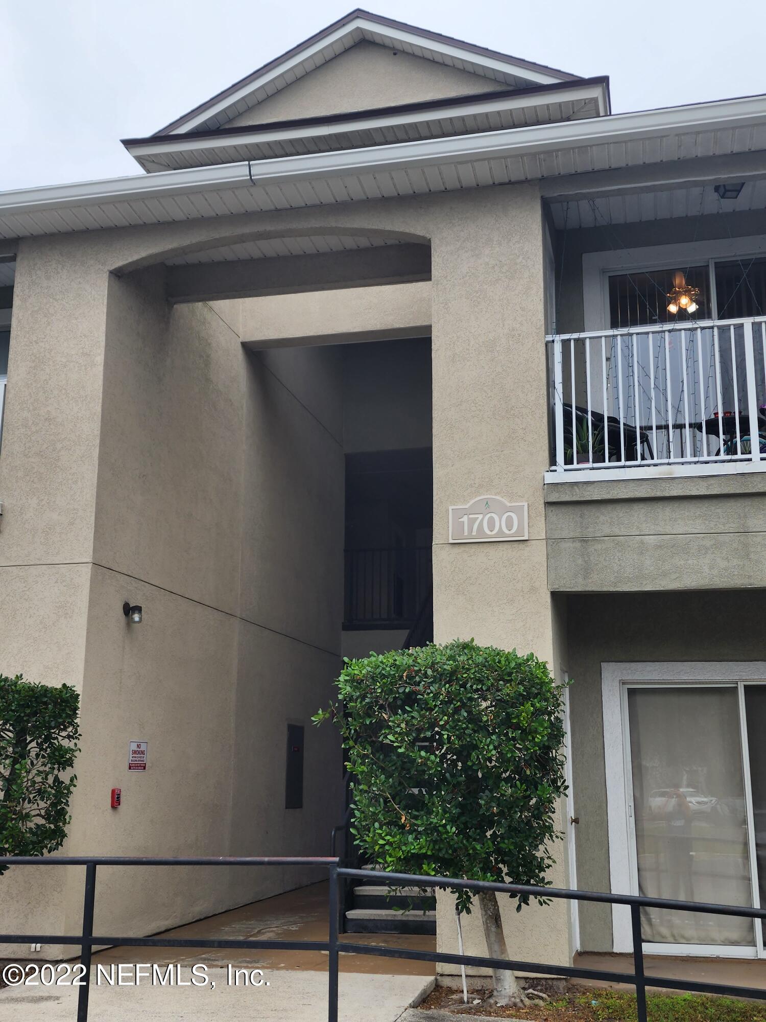 7920 Merrill Road, Unit 1704 Jacksonville, FL 32277 - Photo 2 of 11 a front view of a house with plants