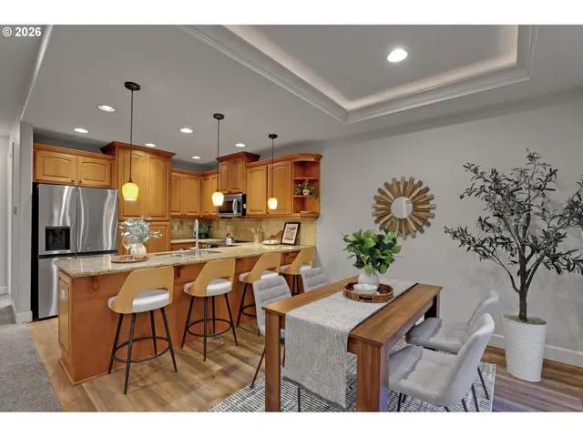 a view of a dining room with furniture and chandelier