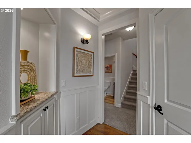 a view of a entryway door with wooden floor