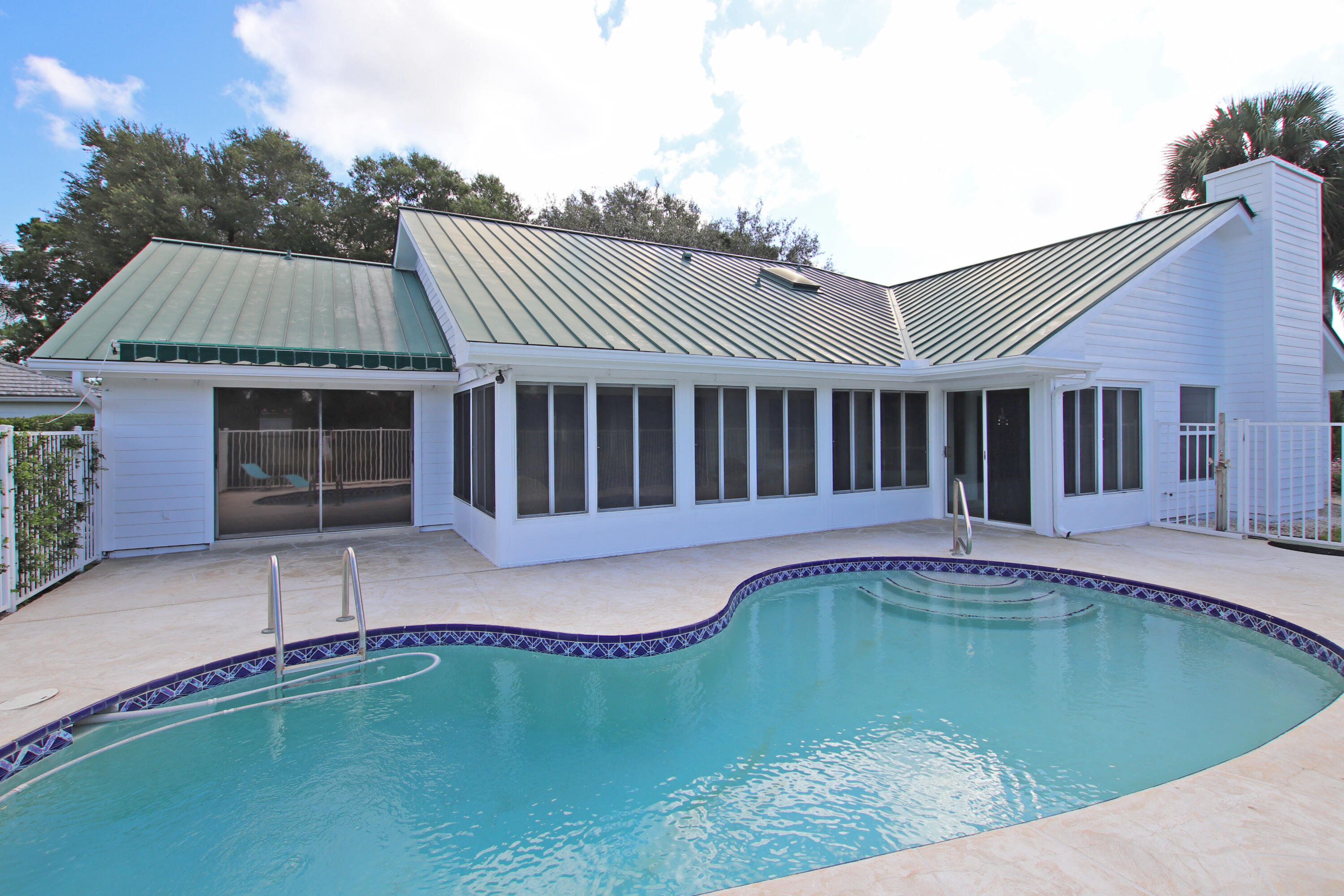 6944 Misty Lake Way Jupiter, FL 33458 - Photo 24 of 32 a view of a house with swimming pool in front of it