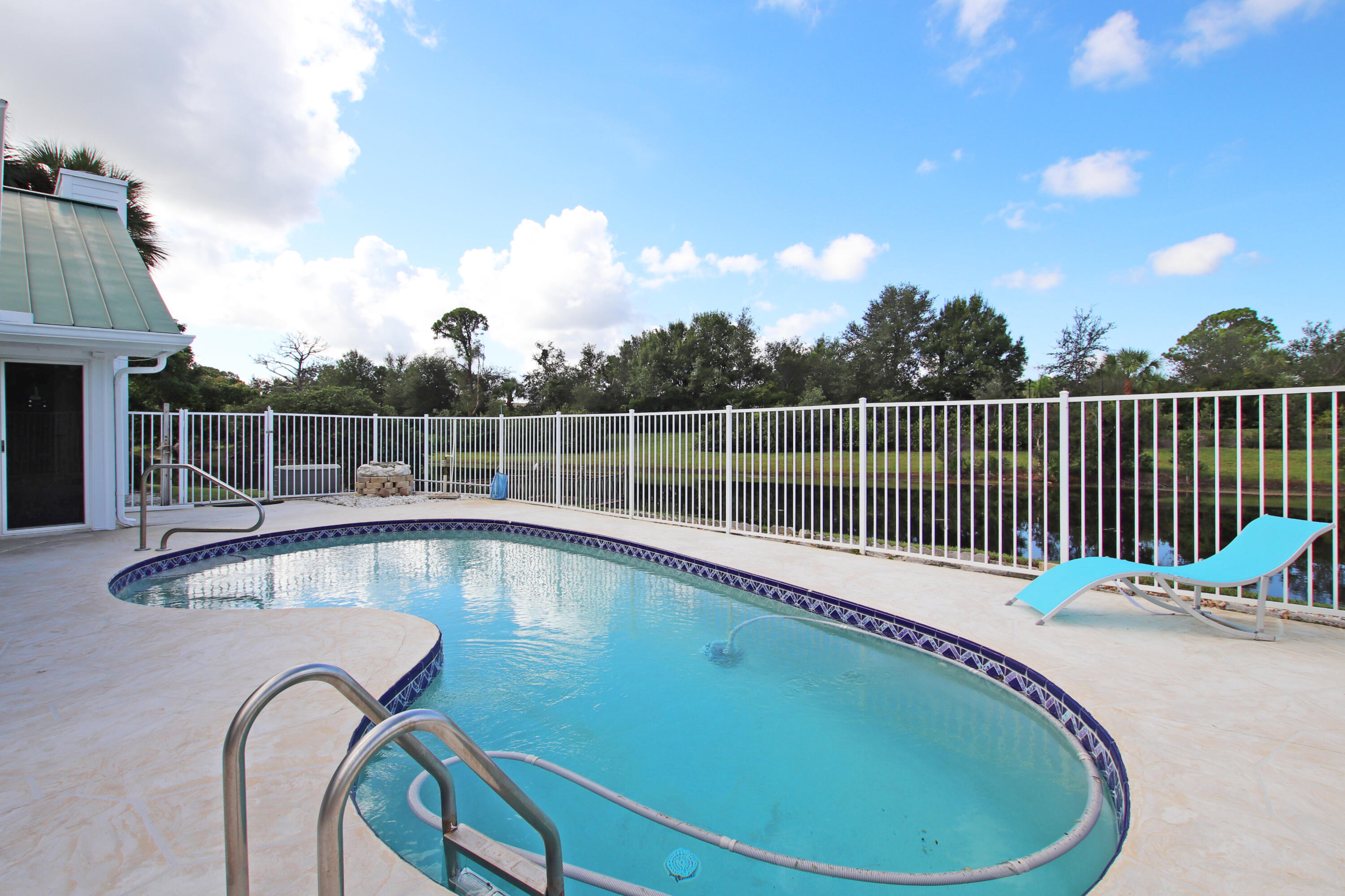 6944 Misty Lake Way Jupiter, FL 33458 - Photo 25 of 32 a view of a swimming pool with a roof deck