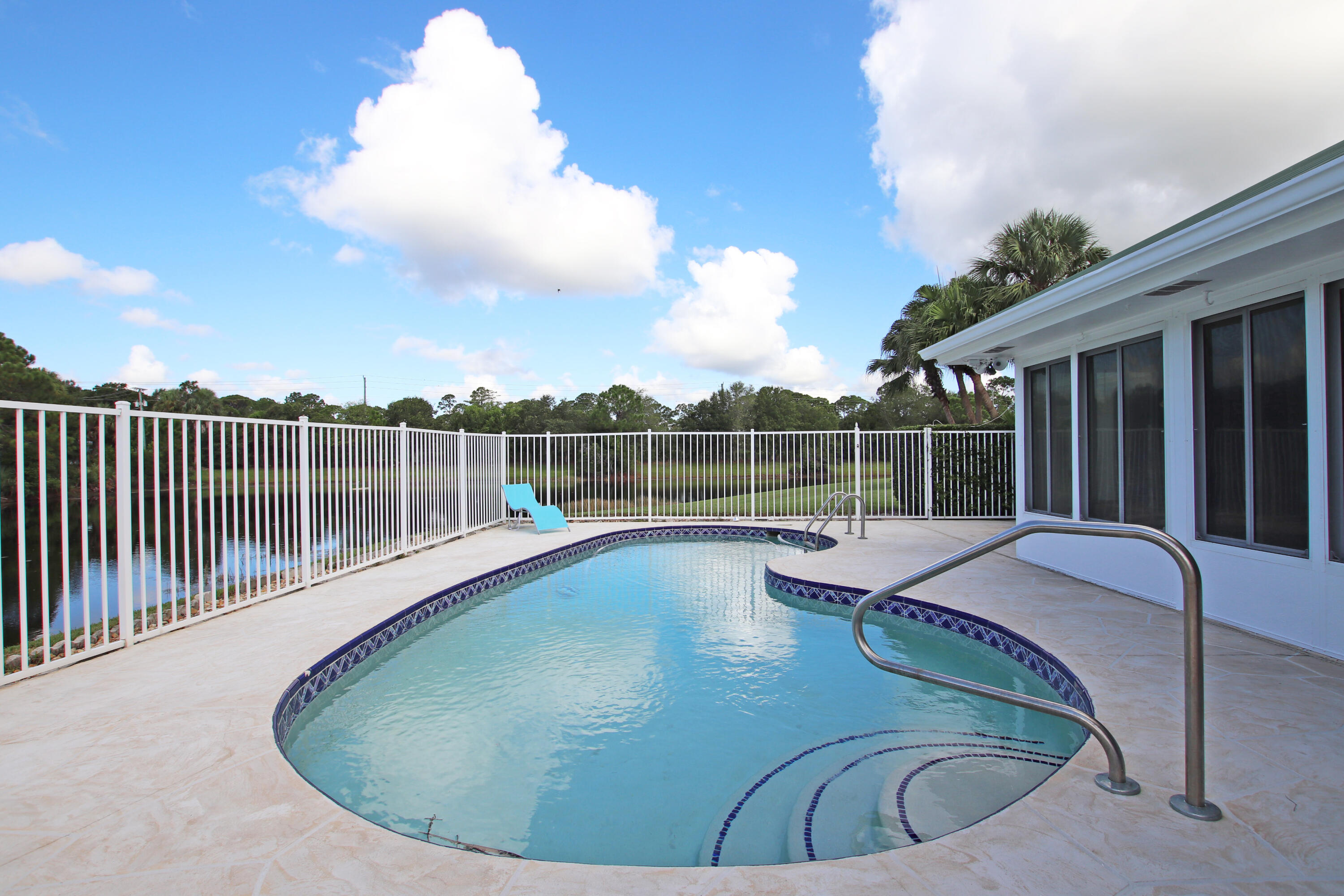 6944 Misty Lake Way Jupiter, FL 33458 - Photo 26 of 32 a view of a house with swimming pool and sitting area
