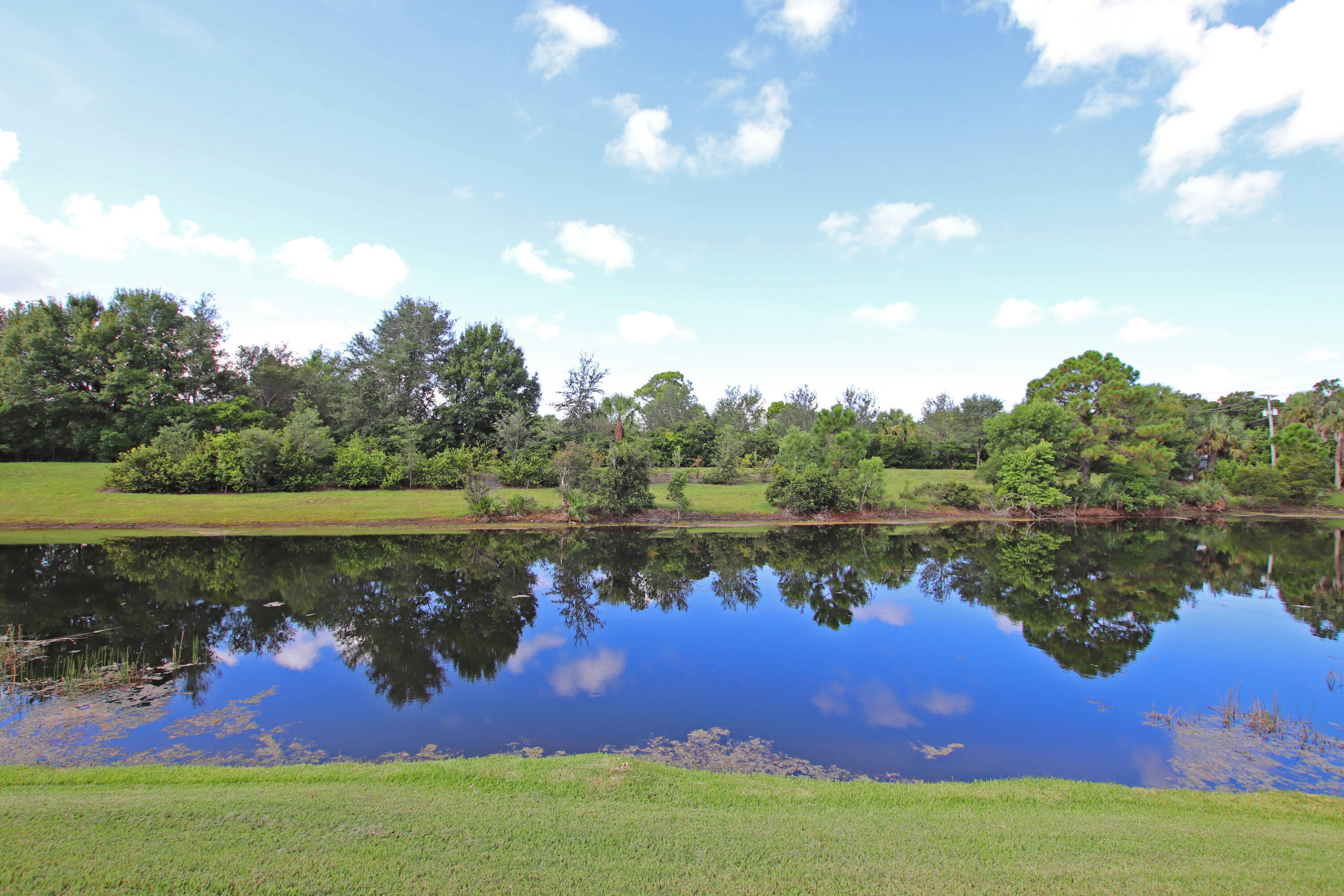 6944 Misty Lake Way Jupiter, FL 33458 - Photo 27 of 32 a lake view with a lake view