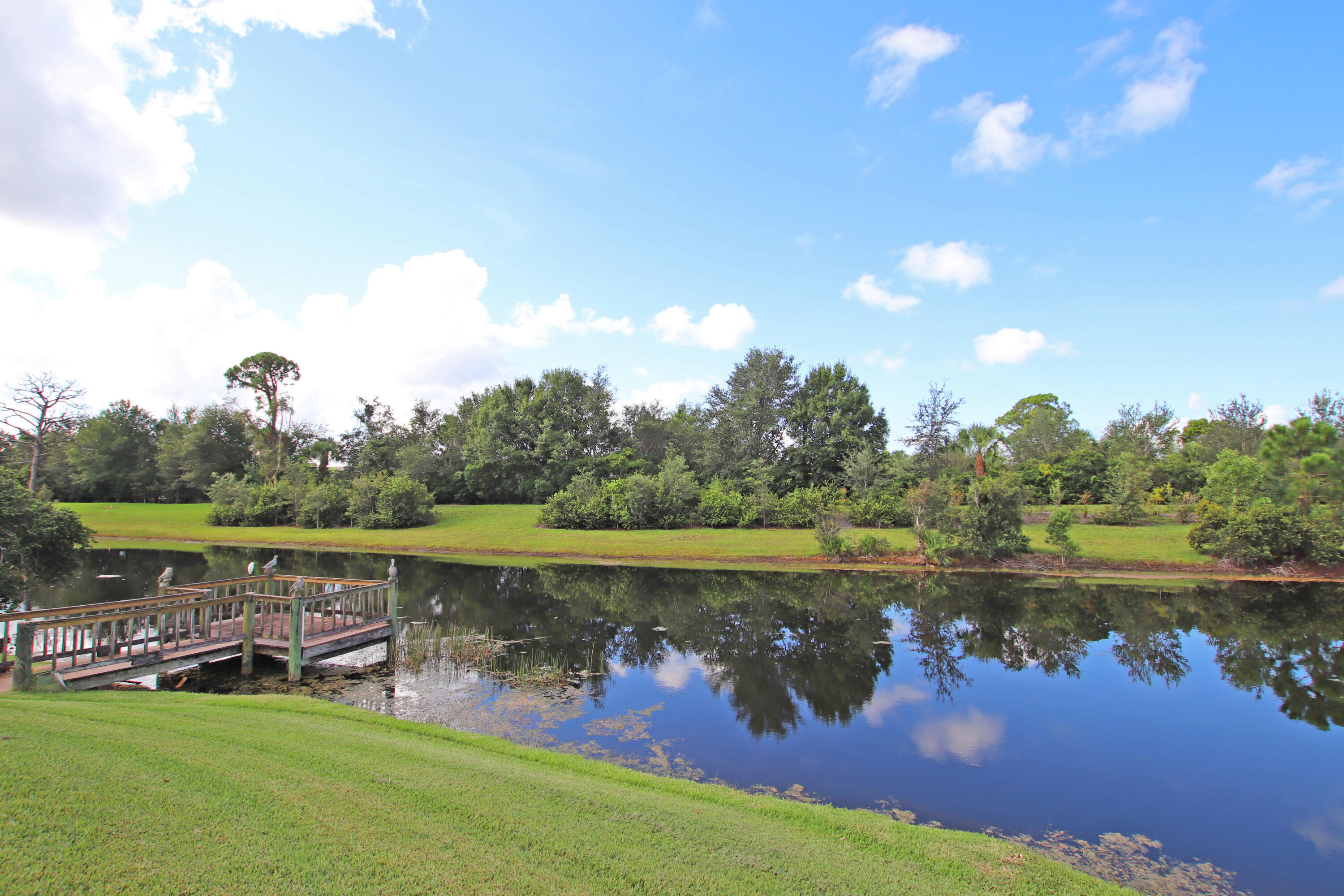 6944 Misty Lake Way Jupiter, FL 33458 - Photo 28 of 32 a view of a lake with outdoor space