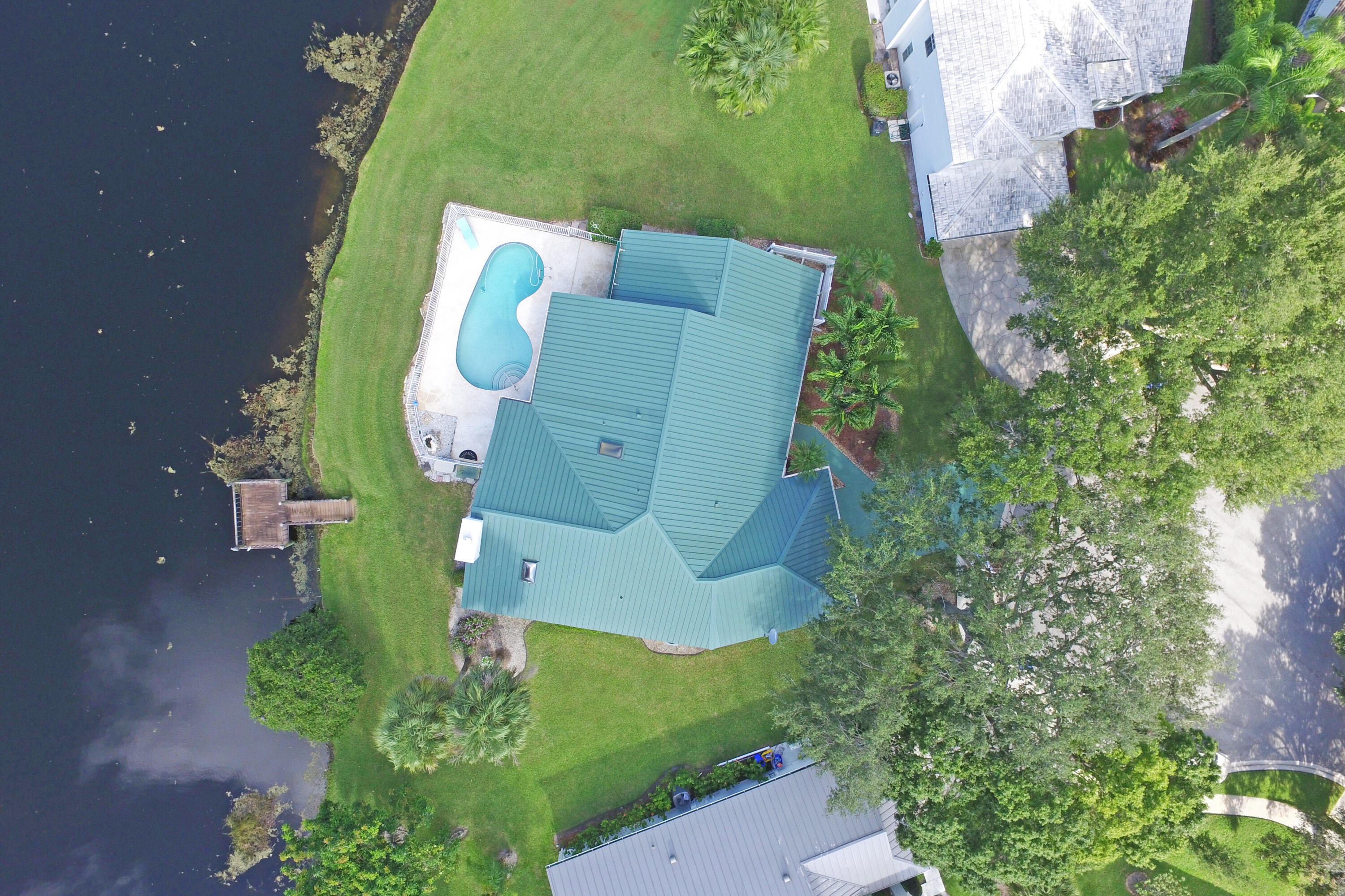6944 Misty Lake Way Jupiter, FL 33458 - Photo 32 of 32 an aerial view of a house with outdoor space and a lake view