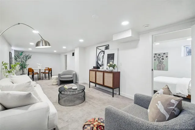 a living room with furniture and a table