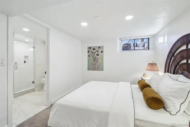 a bedroom with a bed and a couch