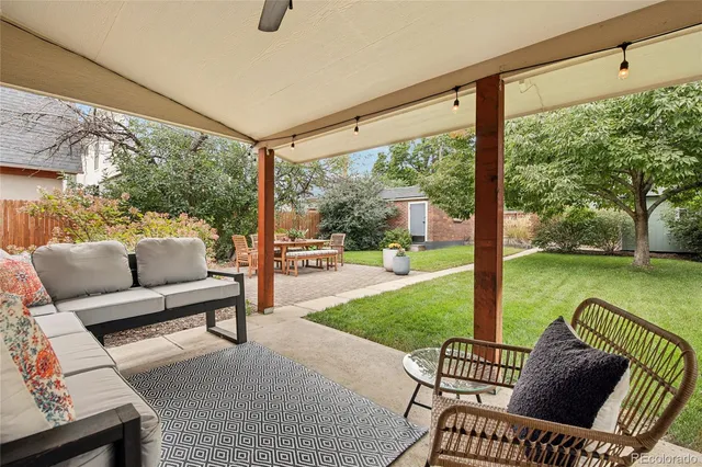 a balcony with furniture and a garden