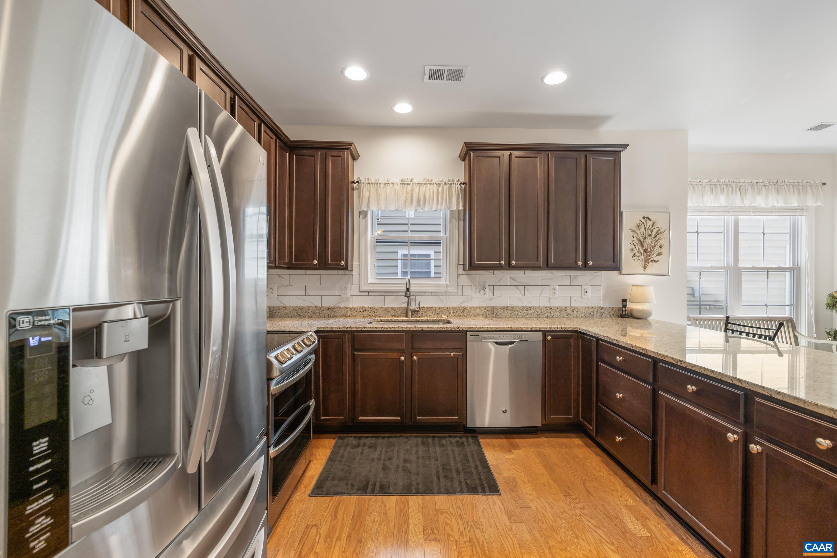 72 Spruce Drive Palmyra, VA 22963 - Photo 18 of 42 a kitchen with stainless steel appliances granite countertop a refrigerator and a sink