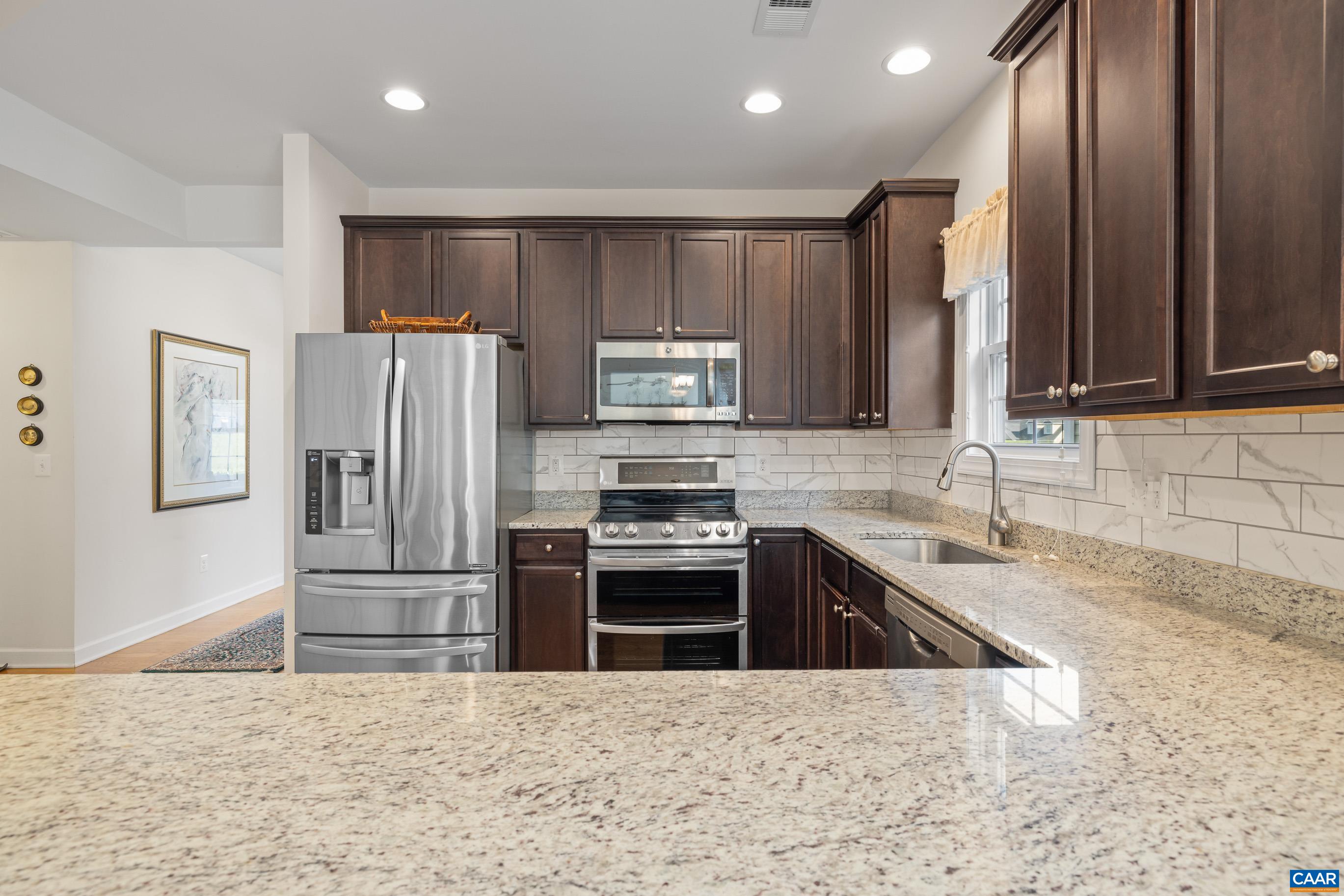 72 Spruce Drive Palmyra, VA 22963 - Photo 20 of 42 a kitchen with granite countertop a refrigerator and a sink