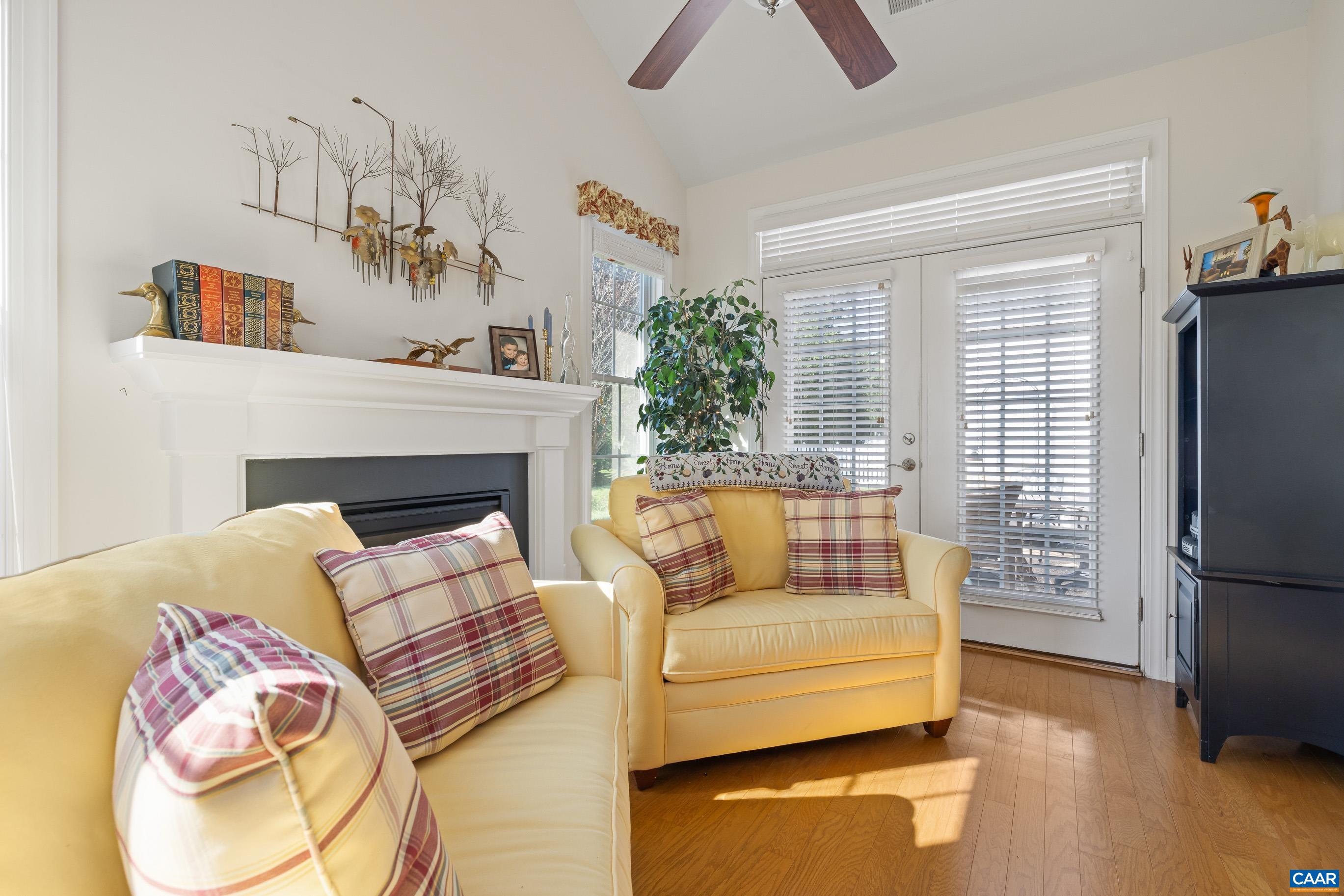 72 Spruce Drive Palmyra, VA 22963 - Photo 28 of 42 a living room with furniture fireplace and flat screen tv
