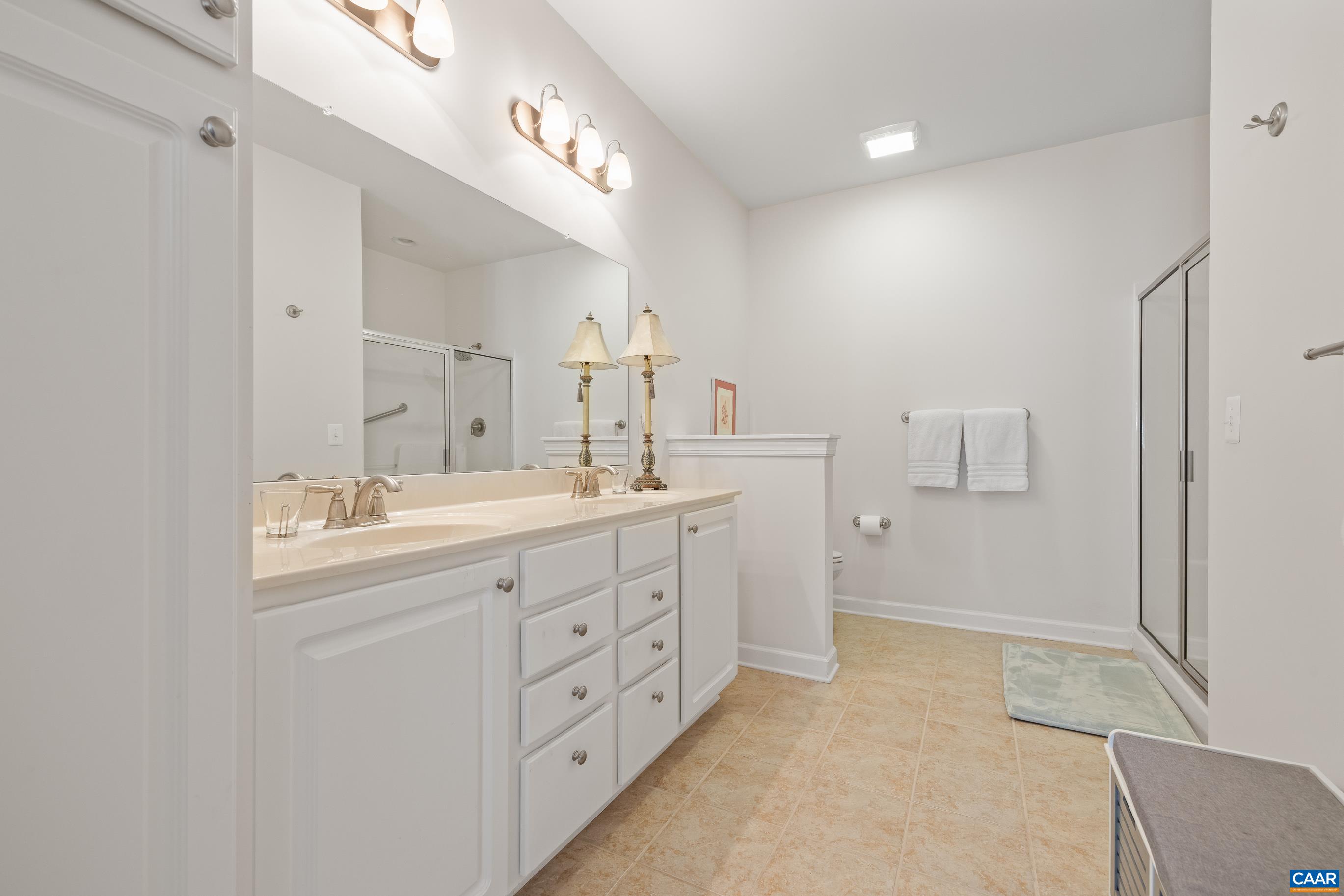 72 Spruce Drive Palmyra, VA 22963 - Photo 31 of 42 a spacious bathroom with double sink and a mirror