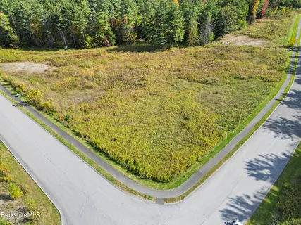 a view of a swimming pool with a outdoor seating