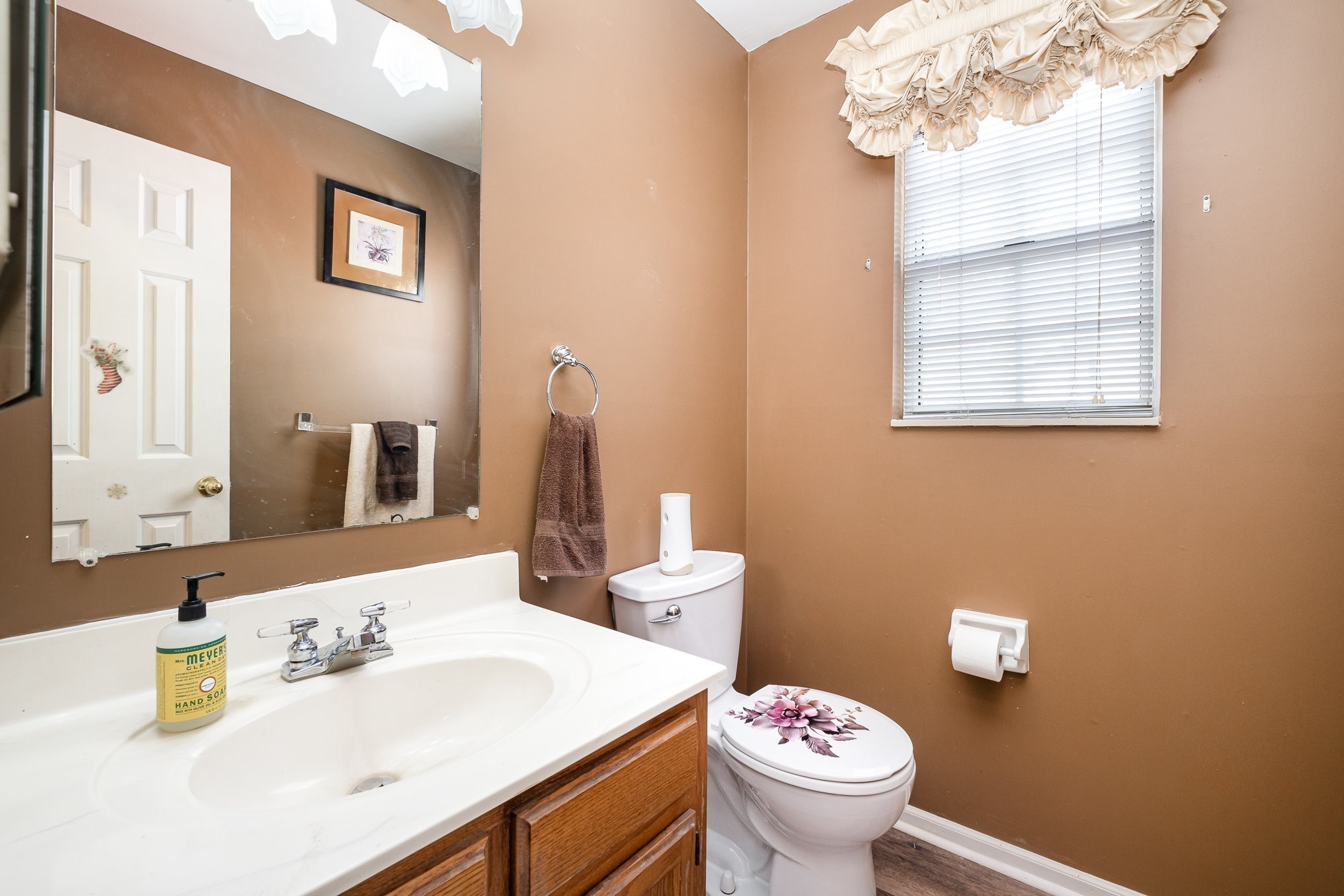 1113 Jacksons Valley Road Hermitage, TN 37076 - Photo 13 of 26 a bathroom with a sink vanity mirror and toilet
