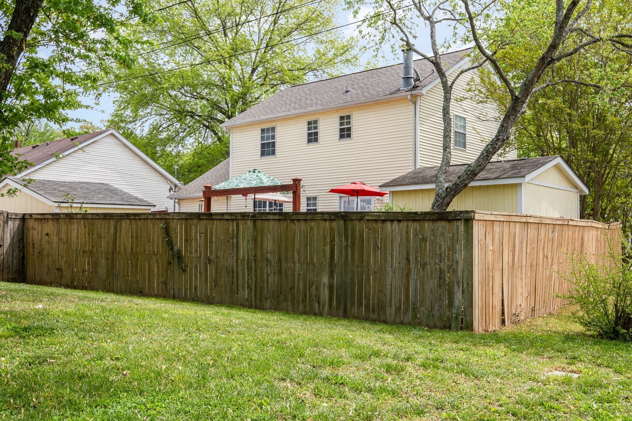 1113 Jacksons Valley Road Hermitage, TN 37076 - Photo 23 of 26 a view of backyard with small cabin and wooden fence