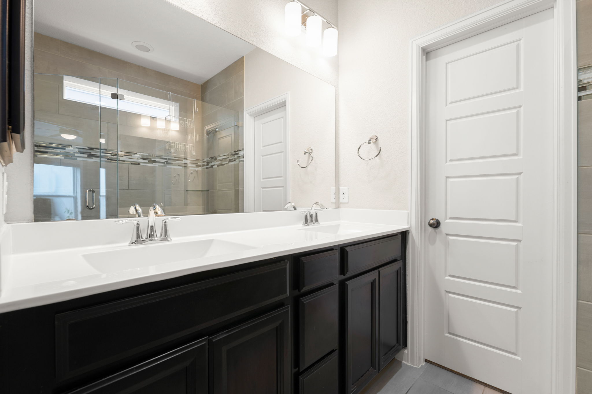 4403 Swift Path Austin, TX 78741 - Photo 14 of 32 Double vanity with integrated sinks and chrome fixtures