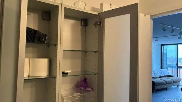 a bathroom with a granite countertop window and a sink