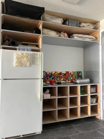 a view of a refrigerator in a kitchen