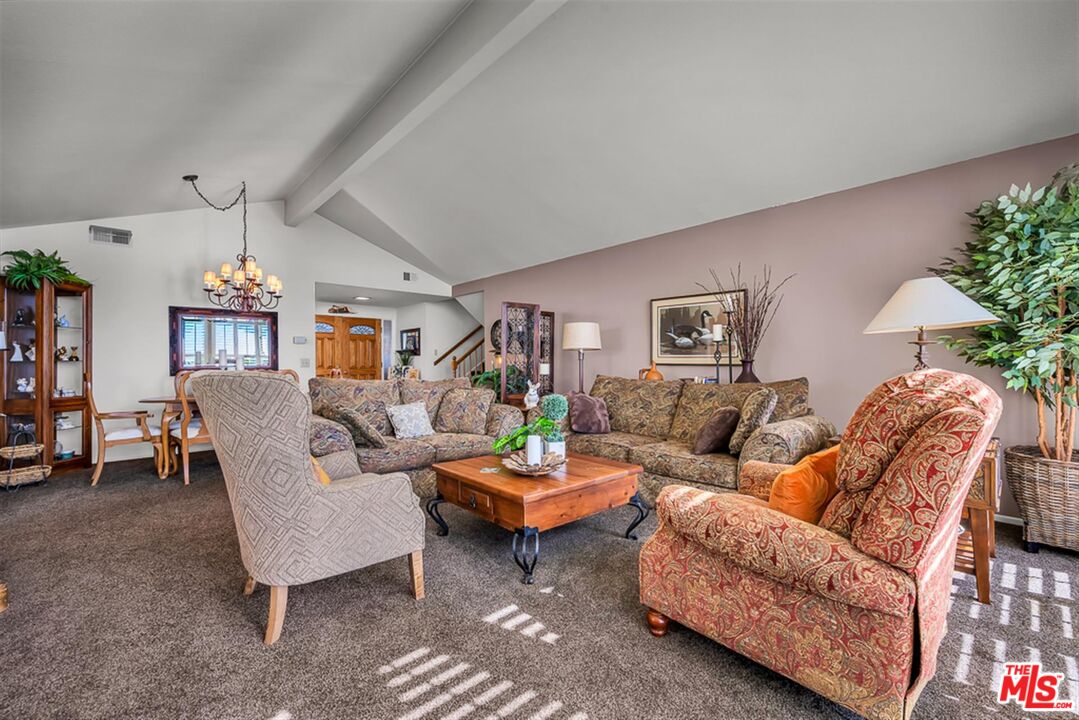 29519 Oceanport Road Rancho Palos Verdes, CA 90275 - Photo 11 of 42 a living room with furniture and a chandelier