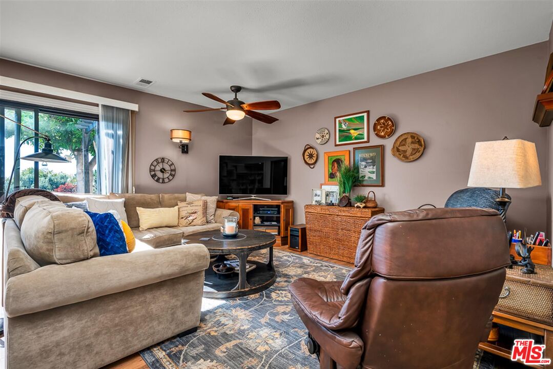 29519 Oceanport Road Rancho Palos Verdes, CA 90275 - Photo 17 of 42 a living room with furniture and a flat screen tv