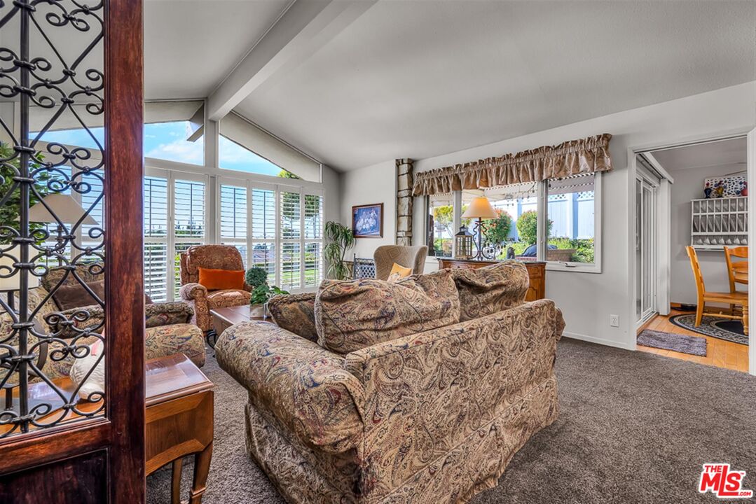 29519 Oceanport Road Rancho Palos Verdes, CA 90275 - Photo 18 of 42 a living room with furniture and a flat screen tv