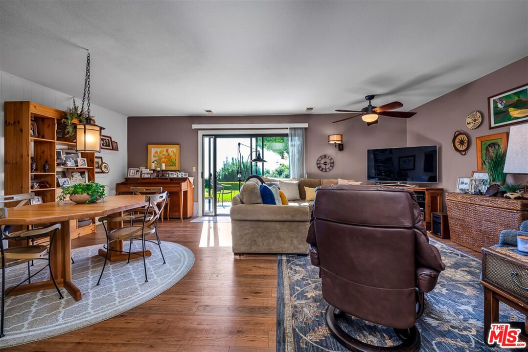 29519 Oceanport Road Rancho Palos Verdes, CA 90275 - Photo 19 of 42 a living room with furniture a flat screen tv and a fireplace