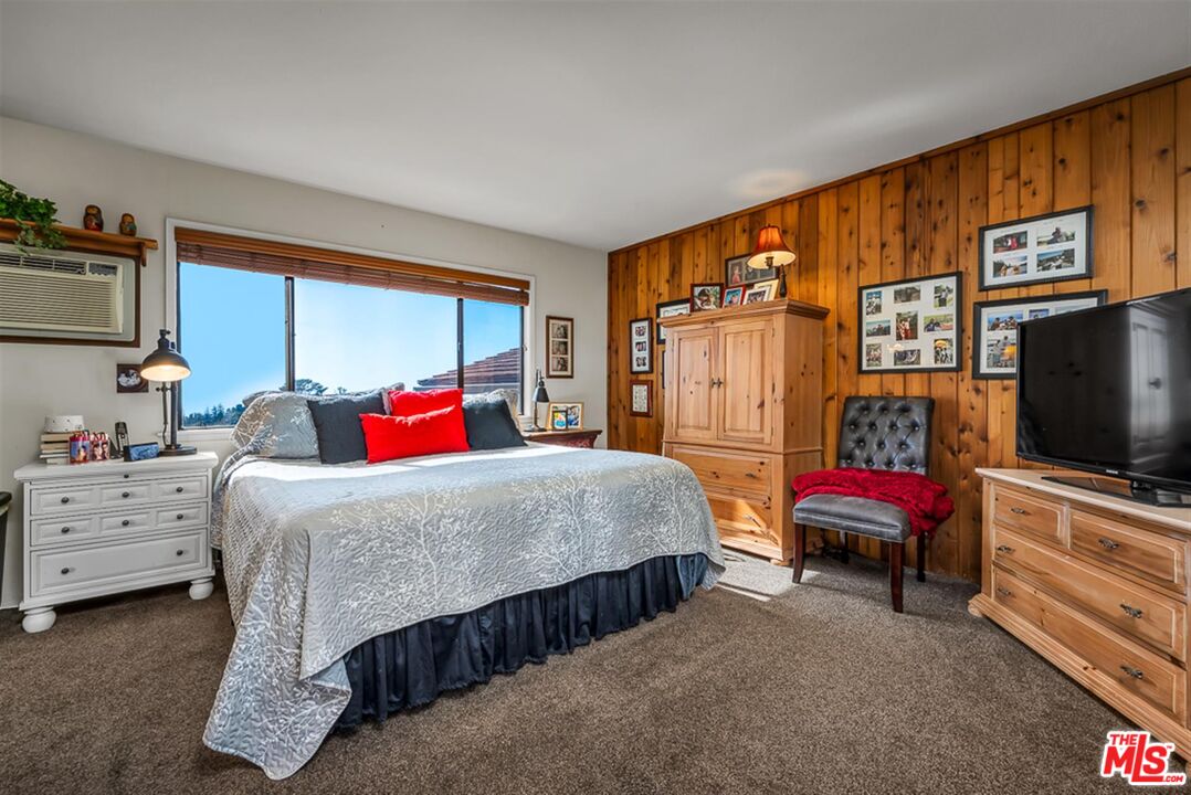 29519 Oceanport Road Rancho Palos Verdes, CA 90275 - Photo 22 of 42 a bedroom with a bed and a flat screen tv