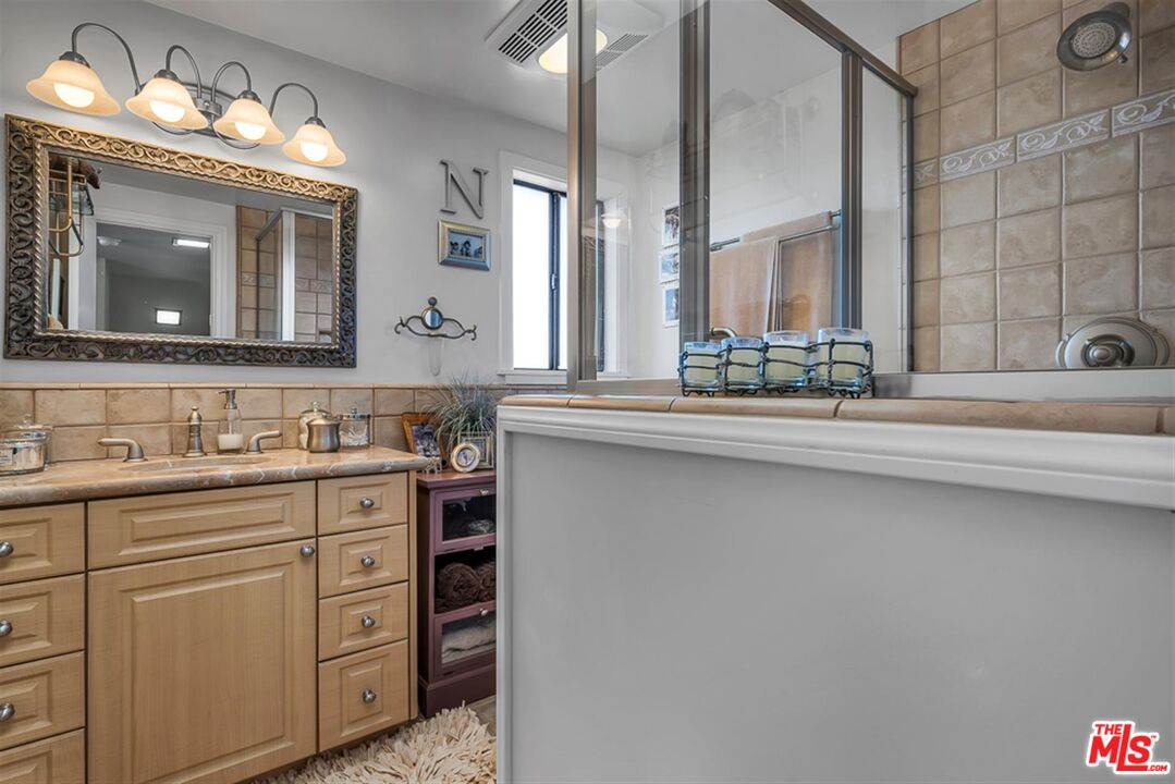 29519 Oceanport Road Rancho Palos Verdes, CA 90275 - Photo 25 of 42 a bathroom with a sink and a mirror