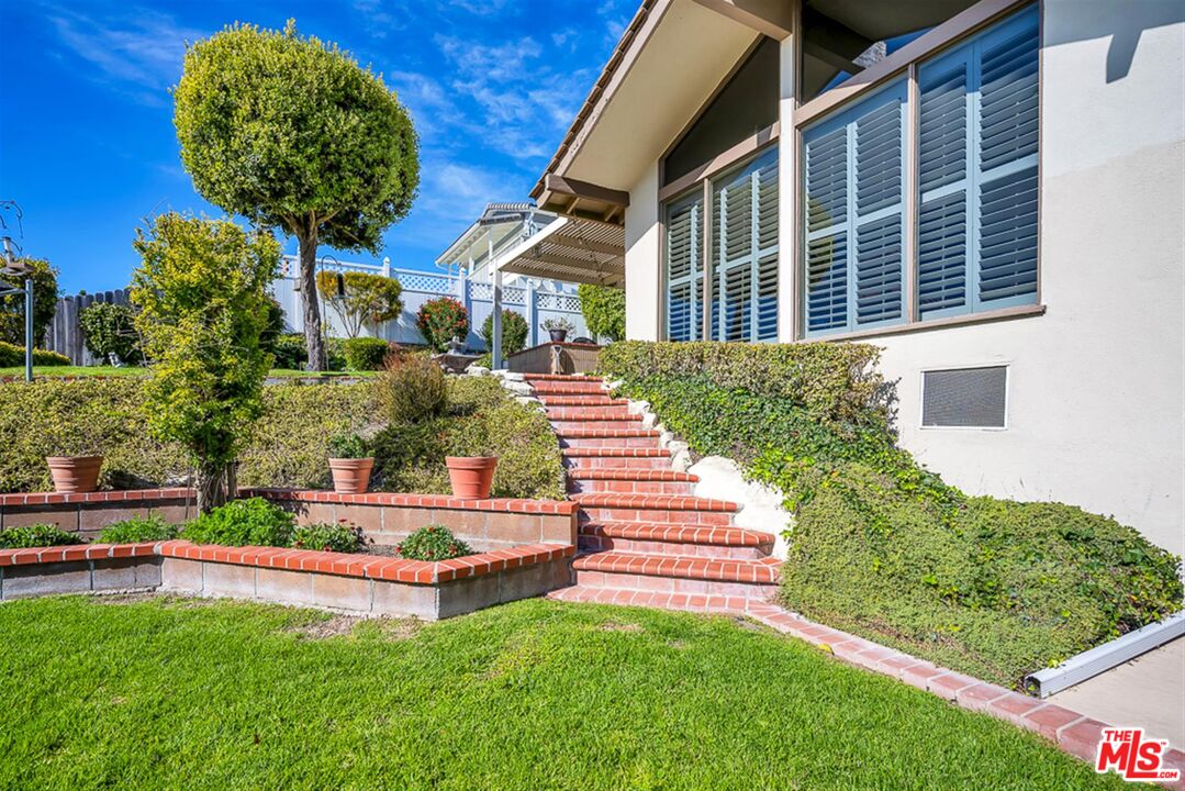 29519 Oceanport Road Rancho Palos Verdes, CA 90275 - Photo 34 of 42 a front view of a house with garden