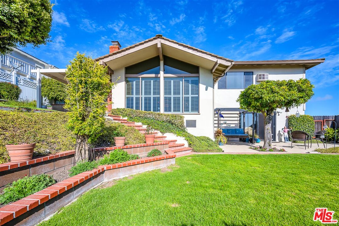 29519 Oceanport Road Rancho Palos Verdes, CA 90275 - Photo 39 of 42 a front view of a house with garden
