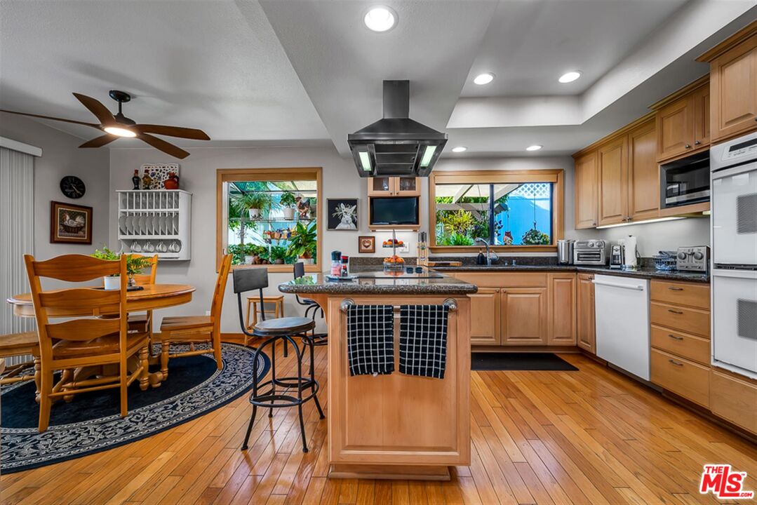 29519 Oceanport Road Rancho Palos Verdes, CA 90275 - Photo 7 of 42 a kitchen with stainless steel appliances granite countertop a stove and a refrigerator