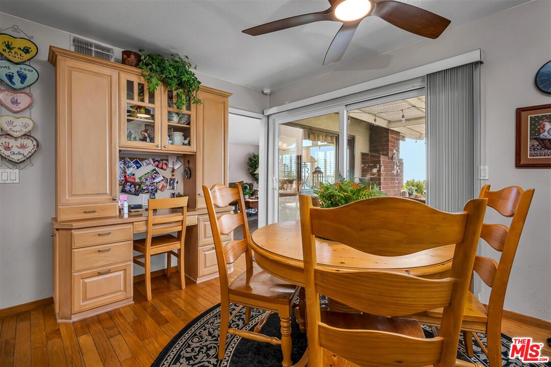 29519 Oceanport Road Rancho Palos Verdes, CA 90275 - Photo 9 of 42 a dining room with furniture and wooden floor