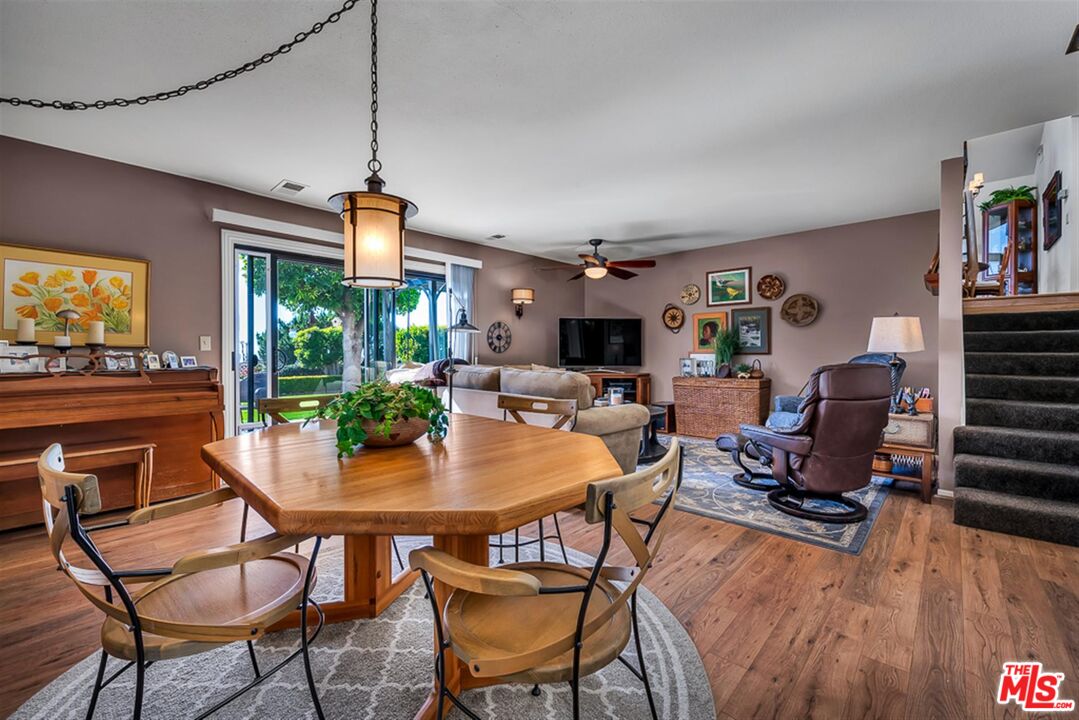 29519 Oceanport Road Rancho Palos Verdes, CA 90275 - Photo 10 of 42 a dining room with furniture a floor to ceiling window and wooden floor
