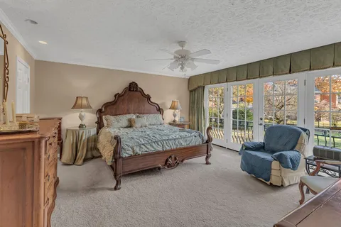 a bedroom with a bed and a couch